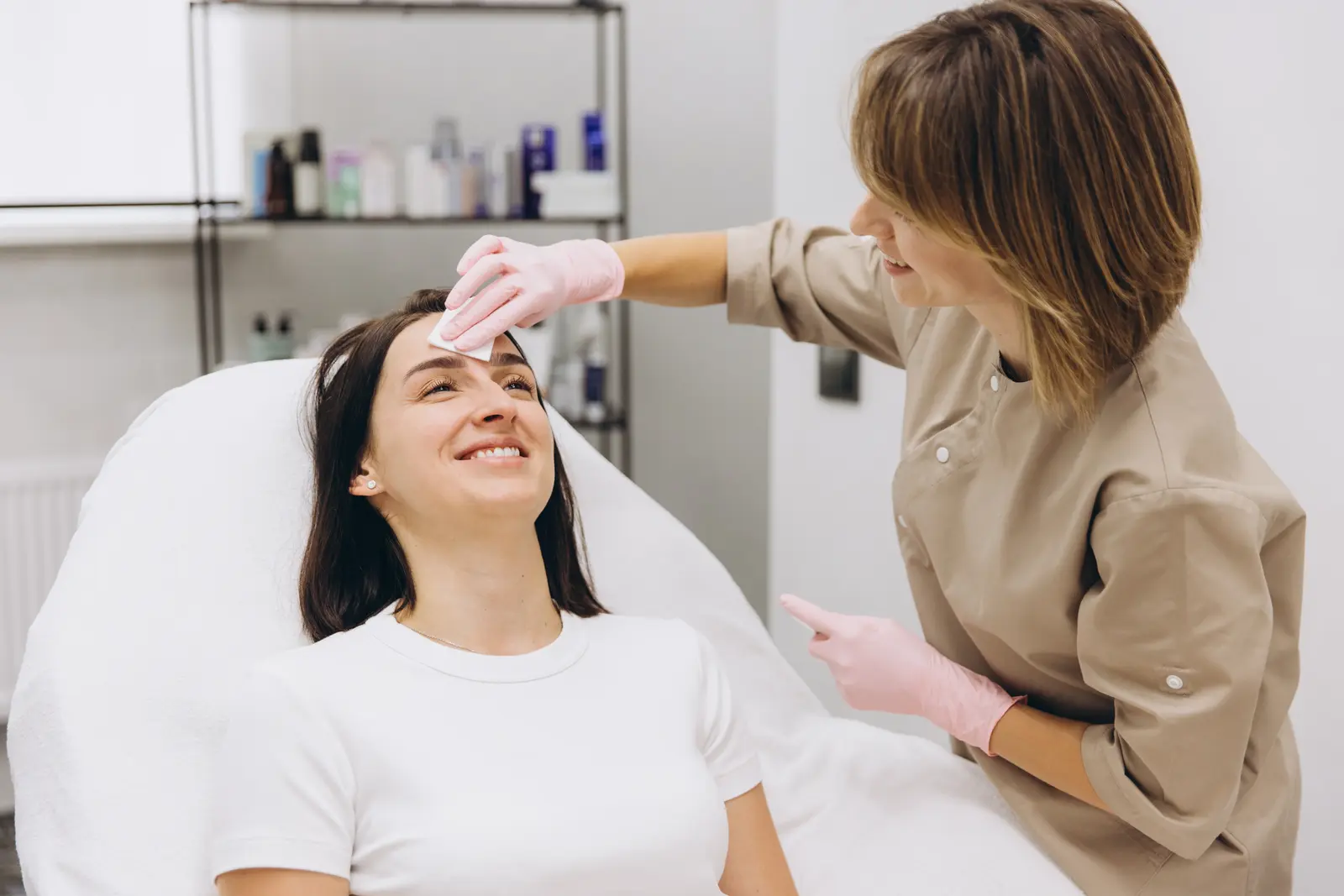 Esthetician performing facial treatment