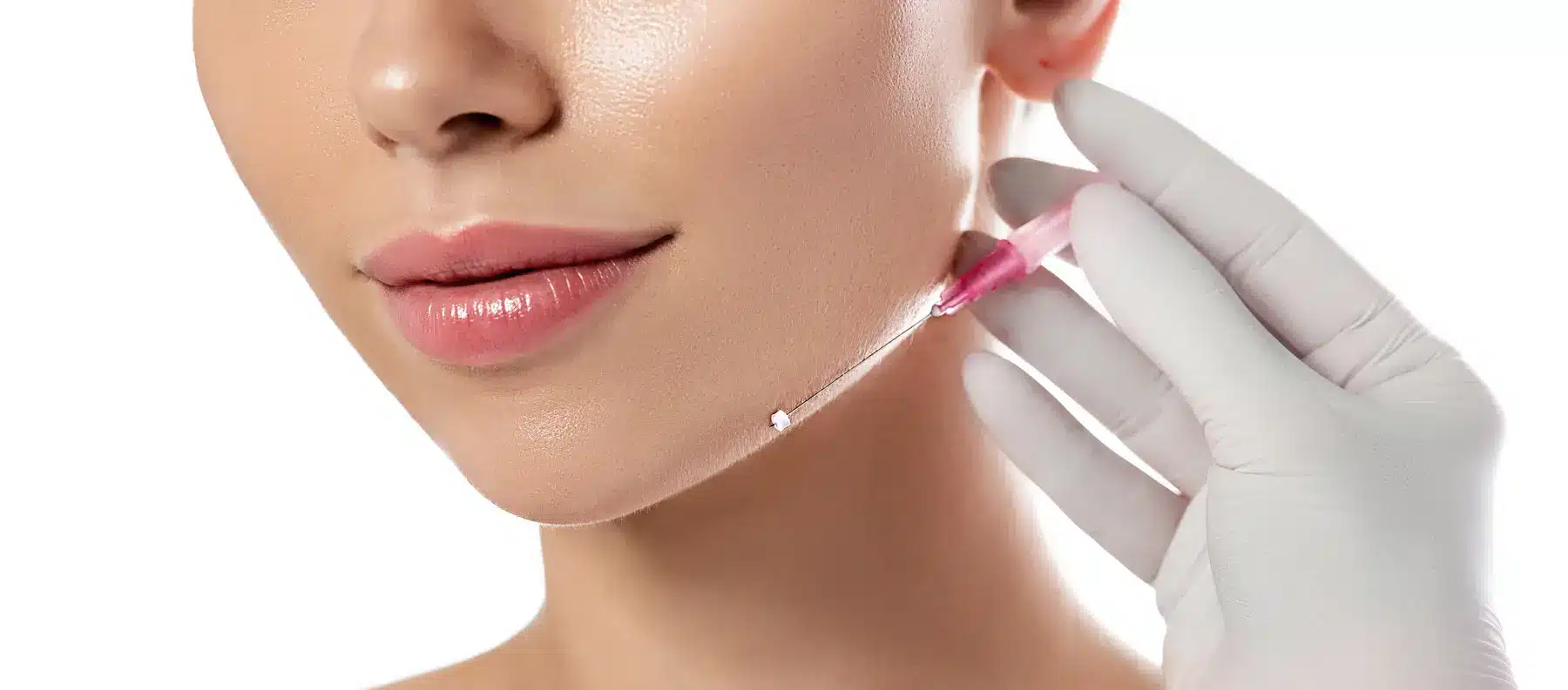 Facial filler injection near jawline with needle.